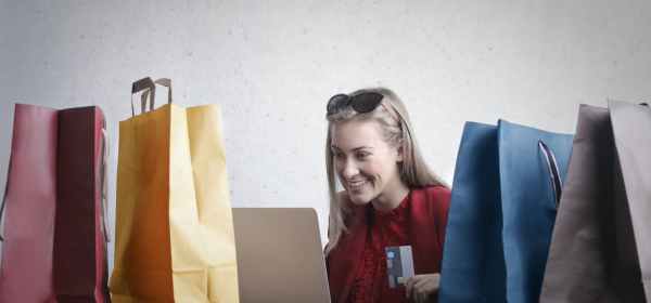 happy woman shopping online at home